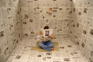 installation of newspaper-covered studio